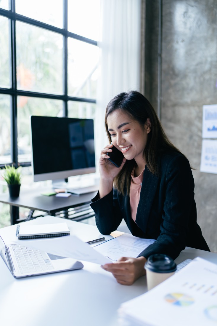 A woman on the phone at a Banking & Financial customer call center